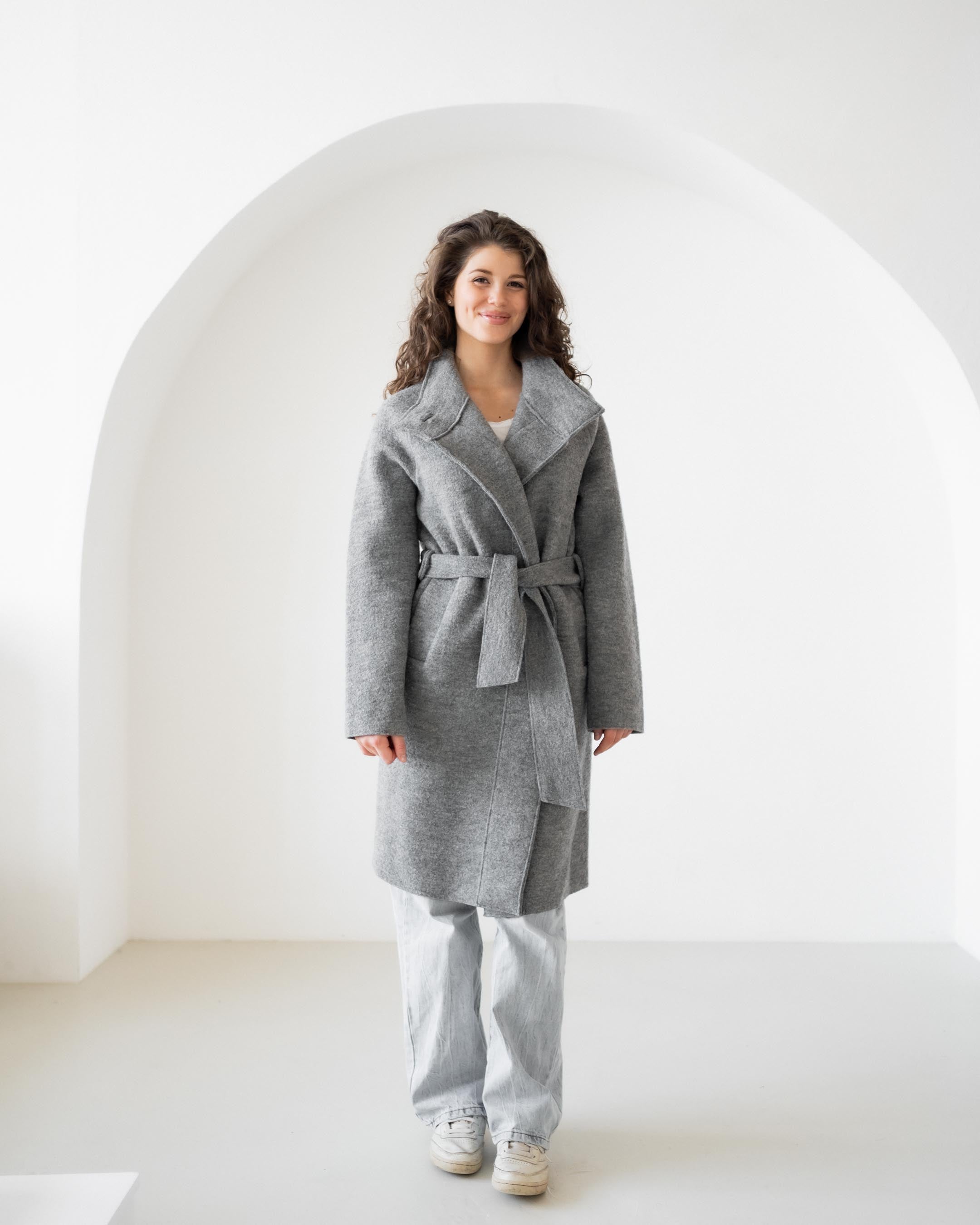Felted coat with waist belt and button