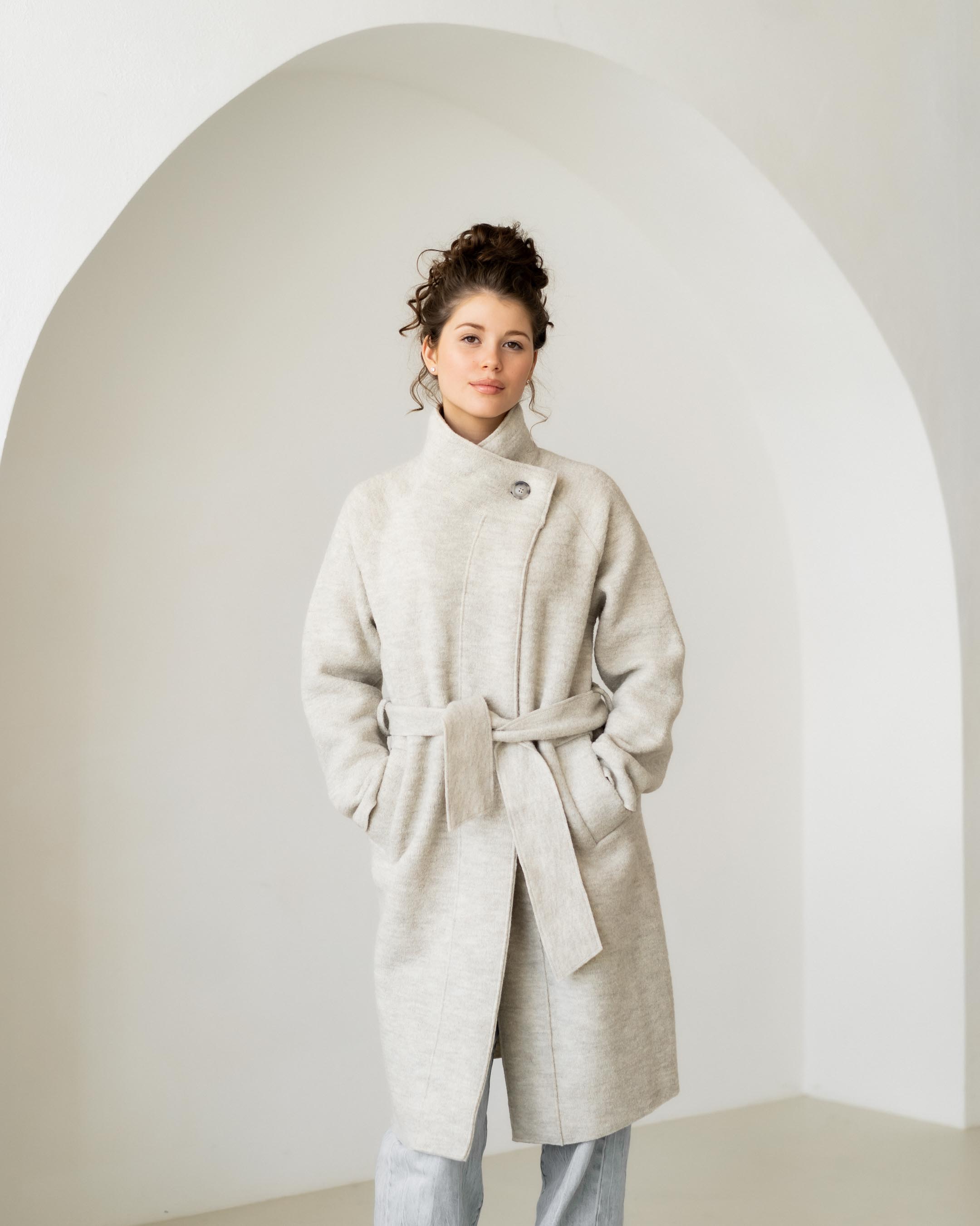 Felted coat with waist belt and button